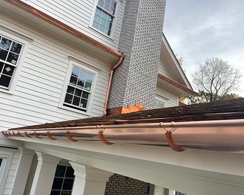 Copper Gutters on White Houses